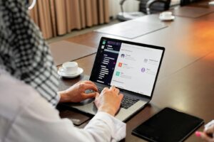 Person Using Macbook Pro on Table