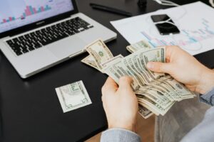 A Person Holding Bank Notes